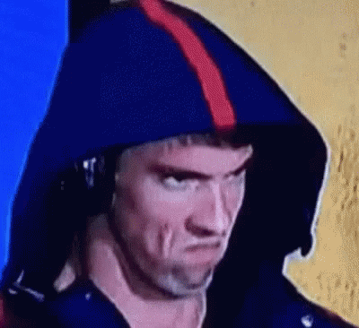 A Close Up Of A Man Wearing A Blue Hoodie And Headphones . GIF