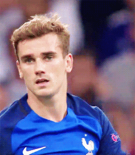 A Close Up Of A Man Wearing A Blue Nike Shirt GIF
