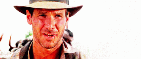 A Close Up Of A Man Wearing A Cowboy Hat And Smiling GIF