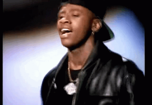 A Close Up Of A Man Wearing A Hat And A Leather Jacket GIF