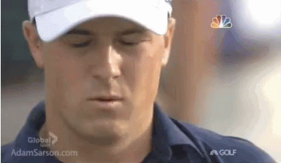 A Close Up Of A Man Wearing A Hat And A Shirt . GIF