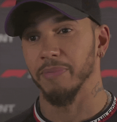A Close Up Of A Man Wearing A Hat And Earrings Saying `` I 'M Definitely Not Fast '' . GIF