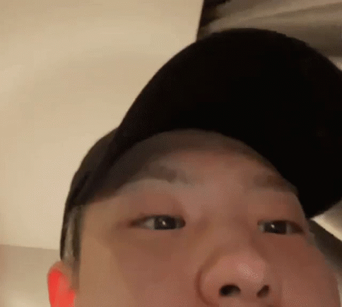 A Close Up Of A Man Wearing A Hat GIF