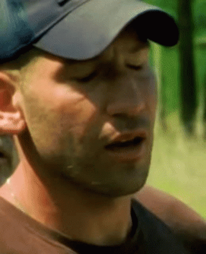 A Close Up Of A Man Wearing A Hat GIF