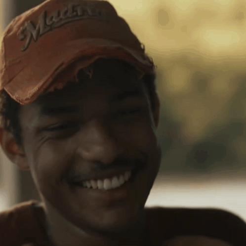 A Close Up Of A Man Wearing A Hat That Says ' Montana ' On It GIF