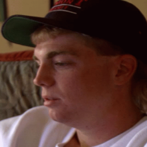 A Close Up Of A Man Wearing A Hat That Says ' Washington ' GIF