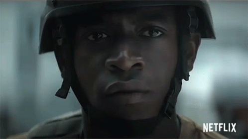 A Close Up Of A Man Wearing A Helmet And A Netflix Logo GIF