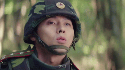 A Close Up Of A Man Wearing A Helmet With A Star On It GIF