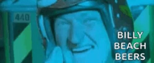 A Close Up Of A Man Wearing A Helmet With The Words `` Billy Beach Beers '' On It . GIF