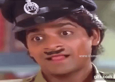 A Close Up Of A Man Wearing A Police Hat With A Mustache . GIF