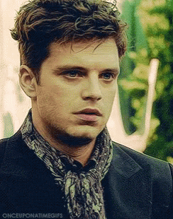A Close Up Of A Man Wearing A Scarf And A Jacket . GIF