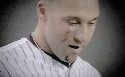 A Close Up Of A Man Wearing A Striped Shirt And A Necklace GIF