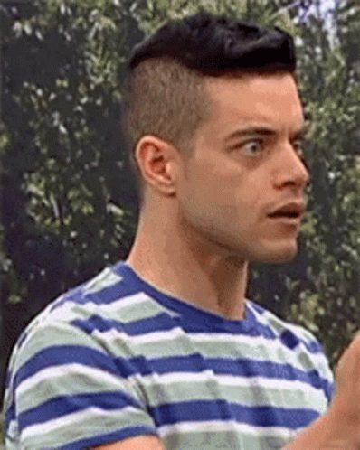 A Close Up Of A Man Wearing A Striped T-Shirt . GIF