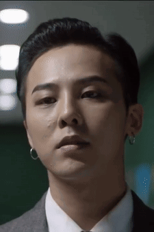A Close Up Of A Man Wearing A Suit And Tie GIF