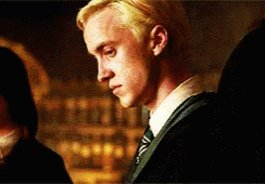 A Close Up Of A Man Wearing A Suit And Tie . GIF