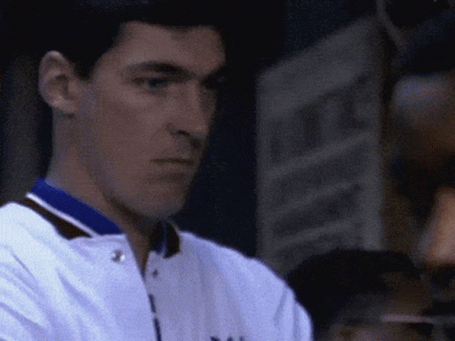 A Close Up Of A Man Wearing A White Jacket With A Blue Collar That Says Yale GIF
