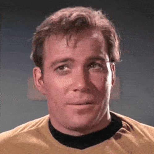 A Close Up Of A Man Wearing A Yellow Shirt And Black Collar GIF