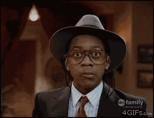 A Close Up Of A Man Wearing Glasses And A Hat With Abc Family On The Bottom GIF