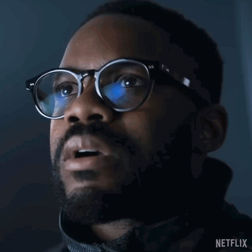 Close-Up Of Man Wearing Glasses And Netflix Logo GIF