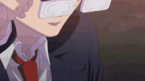 A Close Up Of A Man Wearing Glasses And A Tie GIF