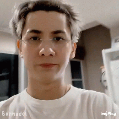 A Close Up Of A Man Wearing Glasses And A White Shirt GIF