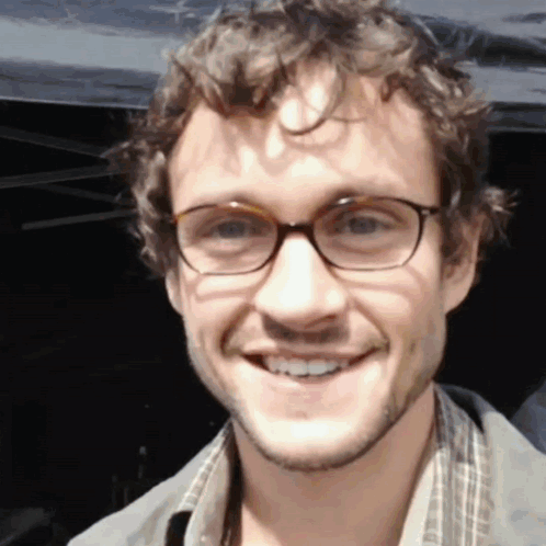 A Close Up Of A Man Wearing Glasses Smiling GIF