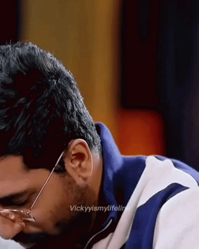 A Close Up Of A Man Wearing Glasses With The Caption Vickyismylifeline On The Bottom GIF