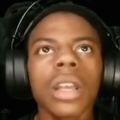 A Close Up Of A Man Wearing Headphones Making A Funny Face . GIF