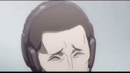 A Close Up Of A Man Wearing Headphones Making A Funny Face . GIF