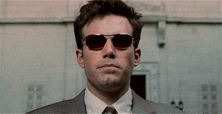 A Close Up Of A Man Wearing Red Sunglasses . GIF