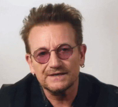 a close up of a man wearing sunglasses and a black jacket