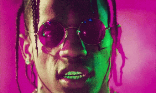 A Close Up Of A Man Wearing Sunglasses On A Purple Background . GIF