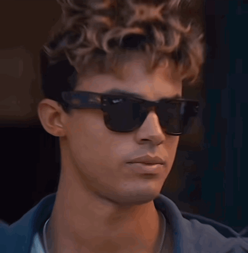 A Close Up Of A Man Wearing Sunglasses GIF