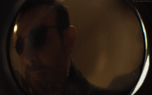 A Close Up Of A Man Wearing Sunglasses With The Words Daredevil Shots On The Bottom Right GIF