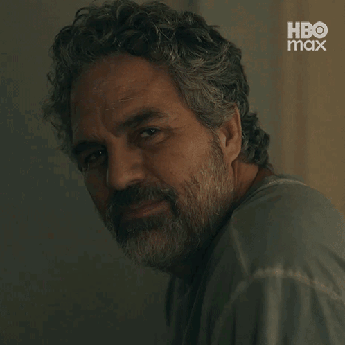 A Close Up Of A Man With A Beard And A Hbo Max Logo GIF