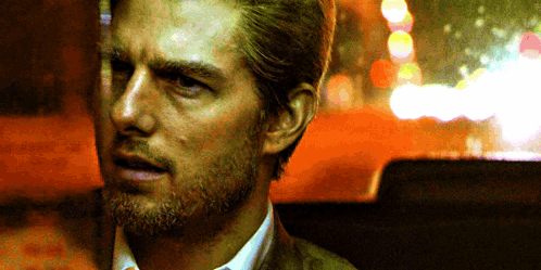 A Close Up Of A Man With A Beard And A Suit GIF