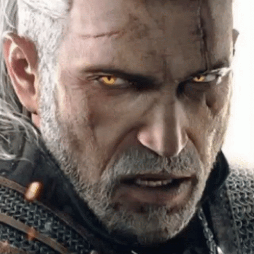 A Close Up Of A Man With A Beard And Glowing Yellow Eyes . GIF