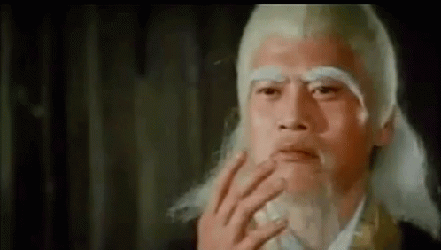 A Close Up Of A Man With A Beard And White Hair . GIF