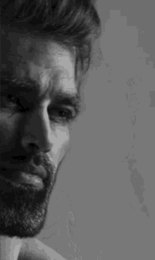 A Close Up Of A Man With A Beard In A Black And White Photo . GIF