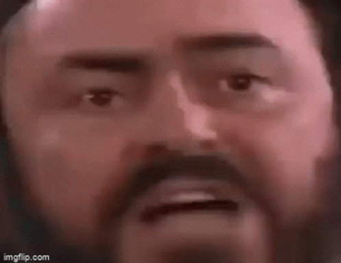 A Close Up Of A Man With A Beard Making A Funny Face . GIF