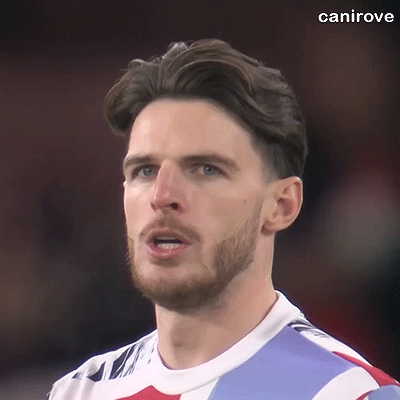 A Close Up Of A Man With A Beard Wearing A Soccer Jersey . GIF