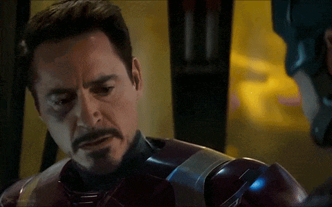 A Close Up Of A Man With A Beard Wearing A Superhero Suit GIF