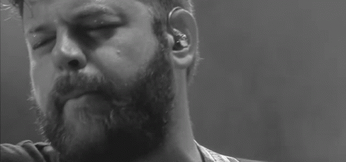 Close Up Of Bearded Man With Earbuds GIF