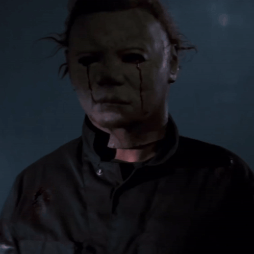a close up of a man with a bloody face