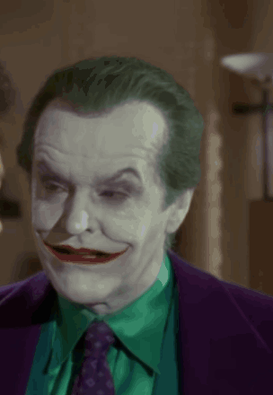 A Close Up Of A Man With A Joker Costume On GIF
