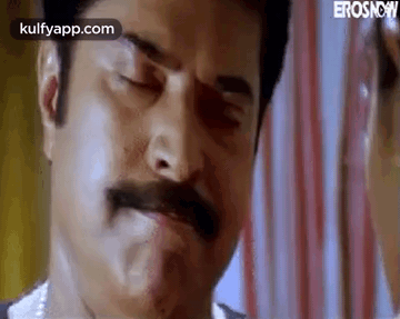 A Close Up Of A Man With A Mustache Making A Face . GIF
