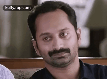 A Close Up Of A Man With A Mustache Making A Funny Face . GIF