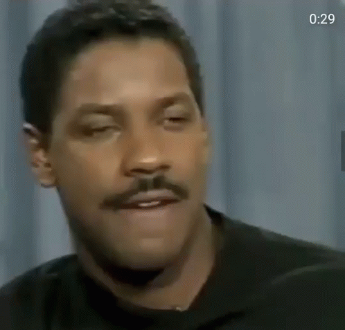 A Close Up Of A Man With A Mustache Making A Funny Face GIF