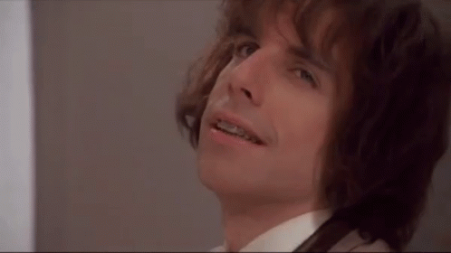 A Close Up Of A Man With Braces On His Teeth Looking Up . GIF