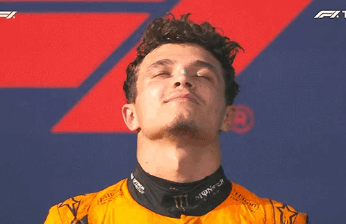 A Close Up Of A Man With His Eyes Closed Wearing A Monster Energy Shirt . GIF